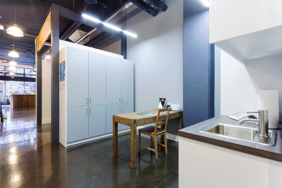 A fitting and work area with white cabinetry at See & Be Seen — Liberty Village