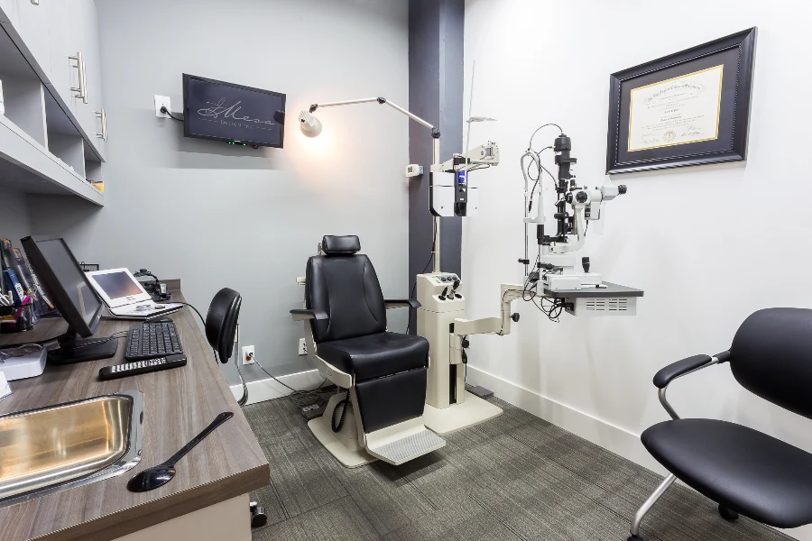 An examination room with integrated cabinetry at See & Be Seen — Liberty Village